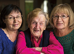 Photo of three women smiling. Links to Gifts by Estate Note